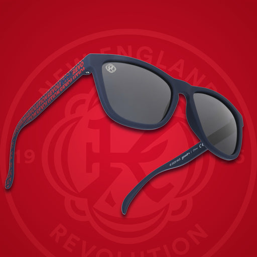 Three-quarter angle view of MLS New England Revolution shades. Black+red frames. Black non-reflective lenses.