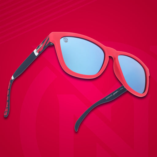 Three-quarter angle view of Major League Soccer St. Louis CITY SC shades. Red+black frames. Blue reflective lenses.