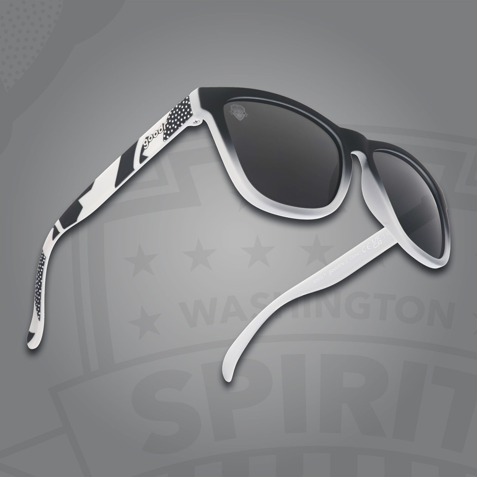 Right three-quarter angle view of black and gray gradient sunglasses featuring black polarized lenses on a gray background.