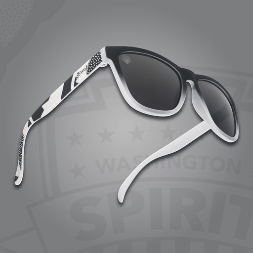 Right three-quarter angle view of black and gray gradient sunglasses featuring black polarized lenses on a gray background.