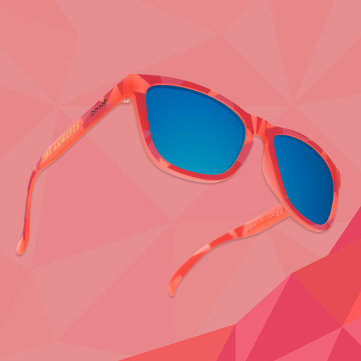 Three-quarter angle view of coral shades w/geometric pattern, Los Angeles printed on temples+teal reflective lenses.