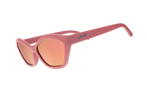 Pink sunglasses with a reflective lens on a white background