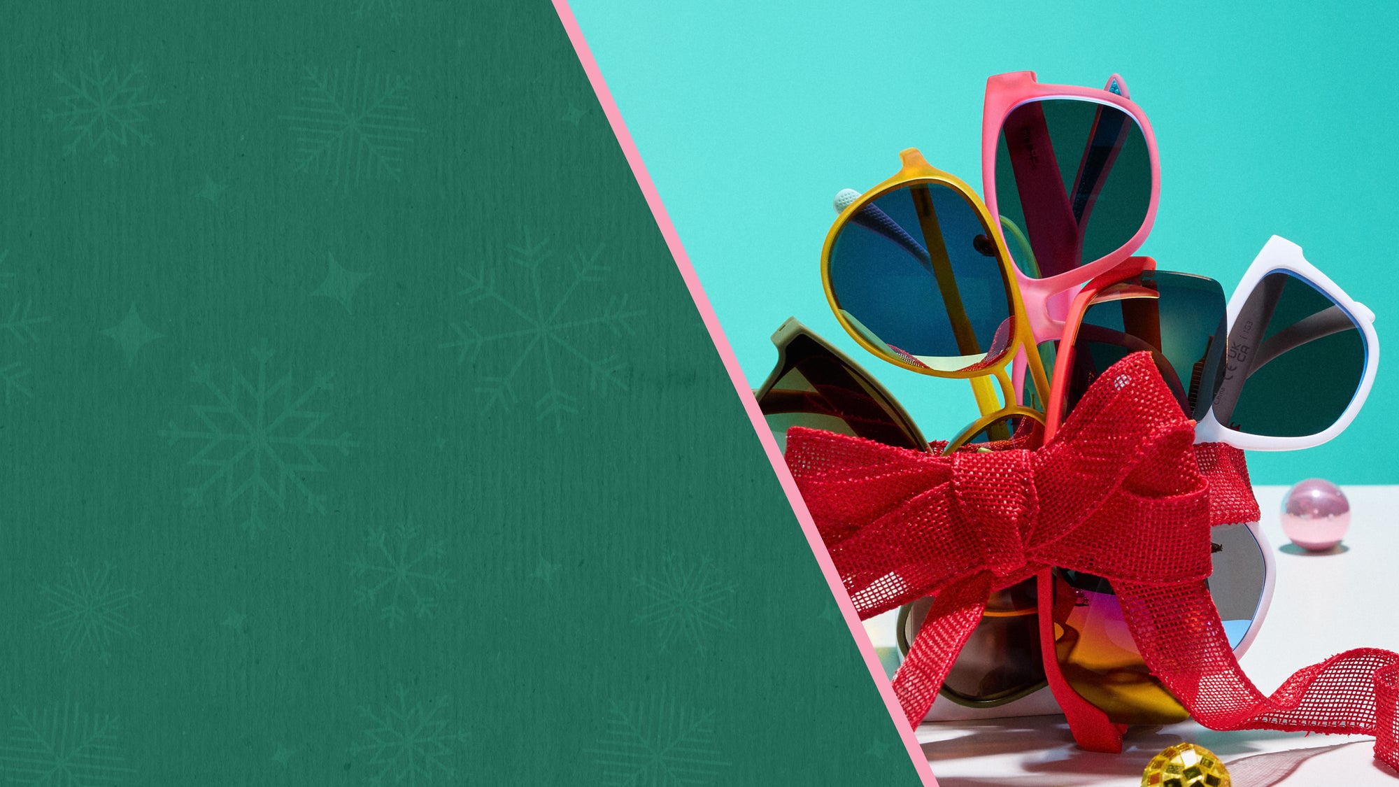 Colorful sunglasses with a red bow on a green and blue background