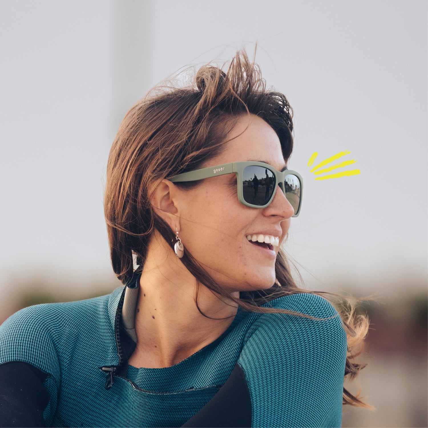 Woman wearing Tidal G sunglasses with a blurred background