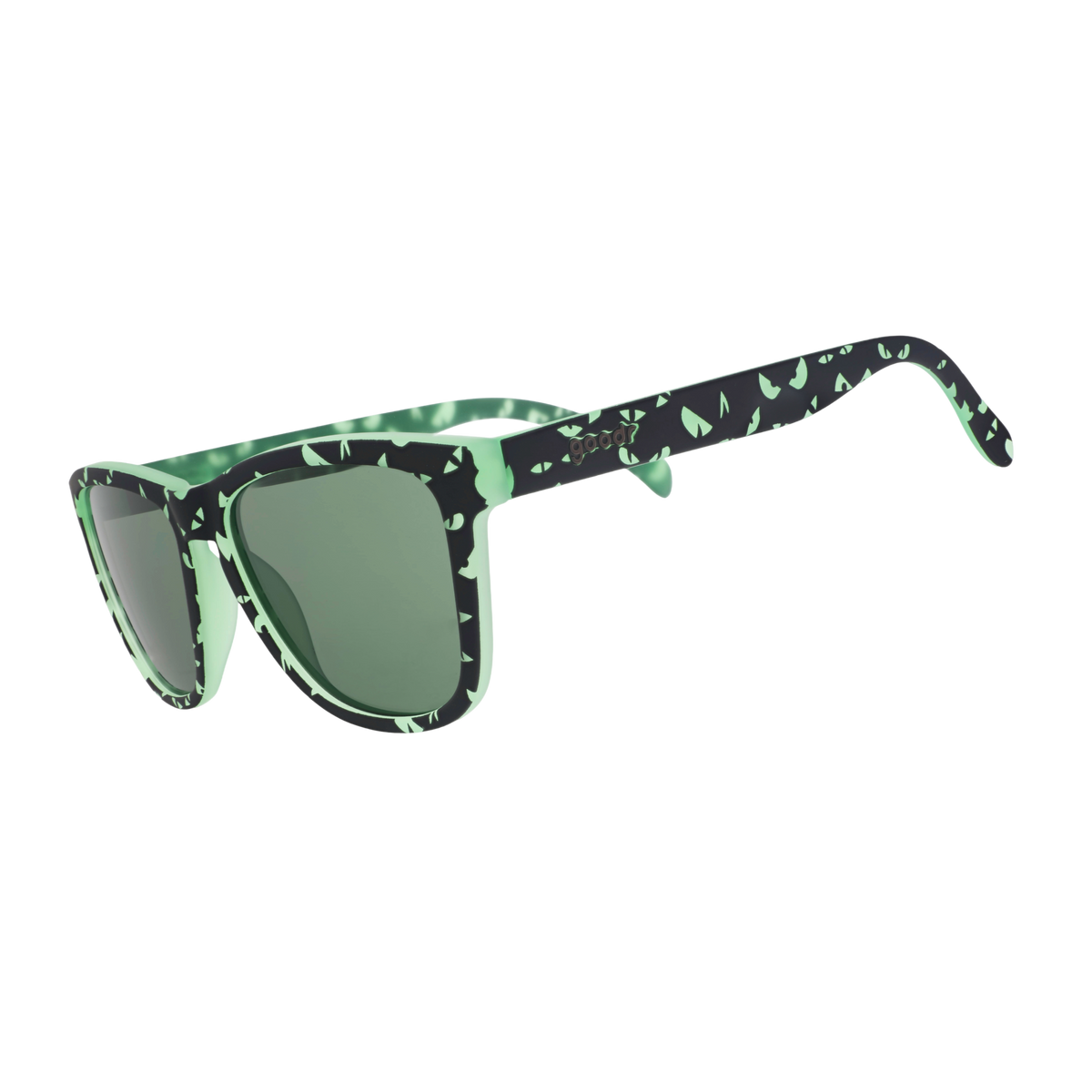 Front view of green-and-black sunnies with a spooky design of glowing eyes and green, non-reflective lenses.