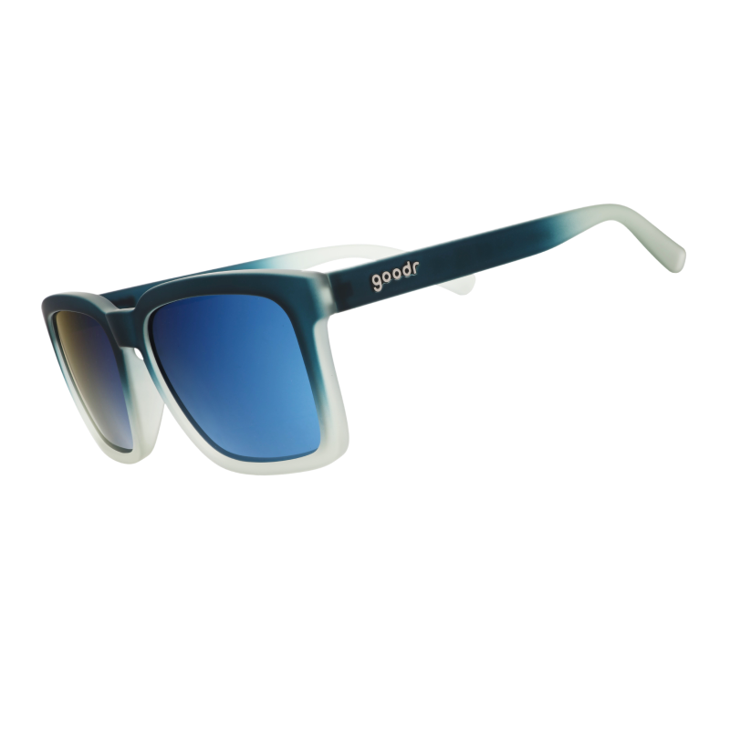 Angled view of translucent black & teal sunglasses w/ blue reflective lenses & a classic square silhouette tilted down.