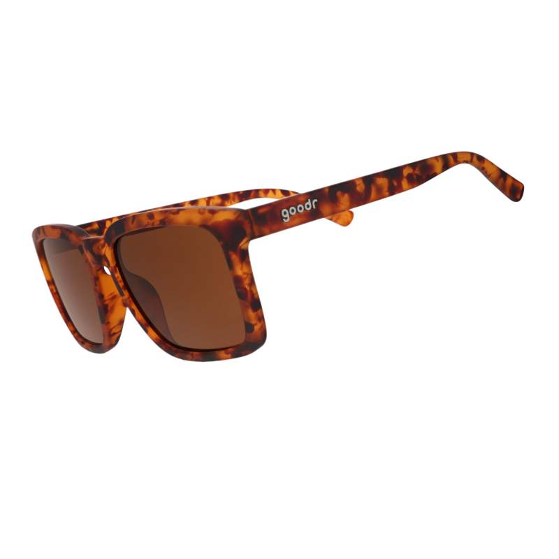 Angled view of translucent brown square sunglasses w/ a tortoiseshell pattern & brown nonreflective lenses tilted down.
