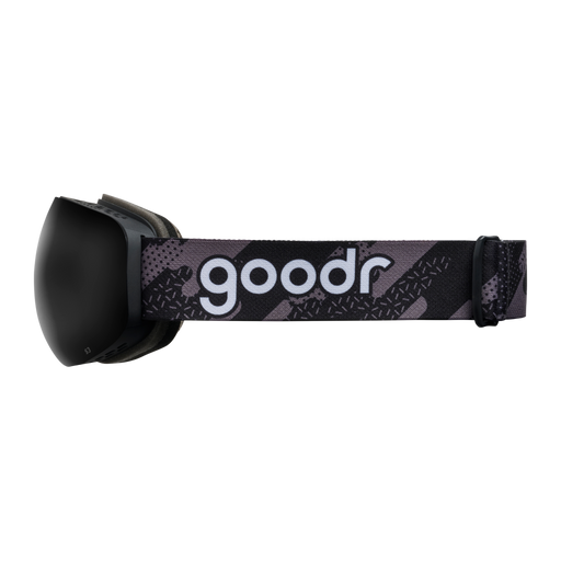 Side view of black snow goggles with a black frame and patterned goodr strap.