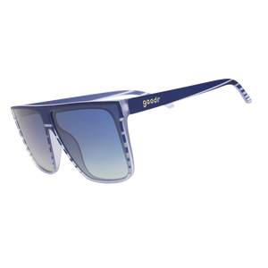 Three-quarter-angle view of translucent blue-purple flat-top Fly Gs with a retrowave-striped design and blue gradient lenses.