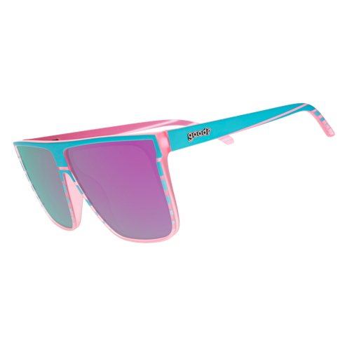 Three-quarter-angle view of translucent pink flat-top Fly G sunglasses with teal retrowave-striped design. 