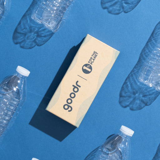 Side view of translucent light blue sunglasses with blue mirrored lenses and logo on arm.