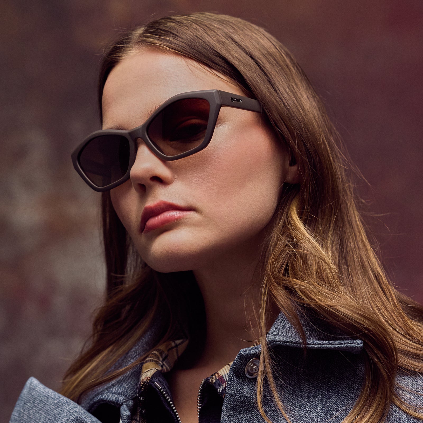 Woman wearing sunglasses with a blurred background