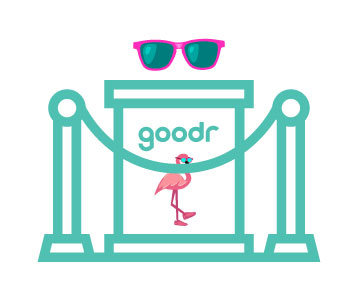 goodr branded podium with a pair of sunglasses sitting on top, behind a rope gate